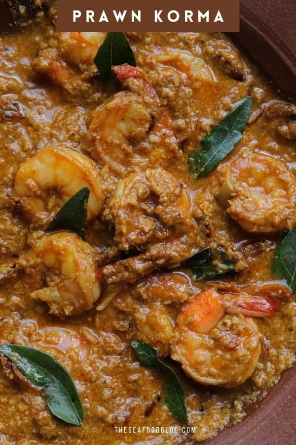 thick prawn korma curry served in a clay pot.