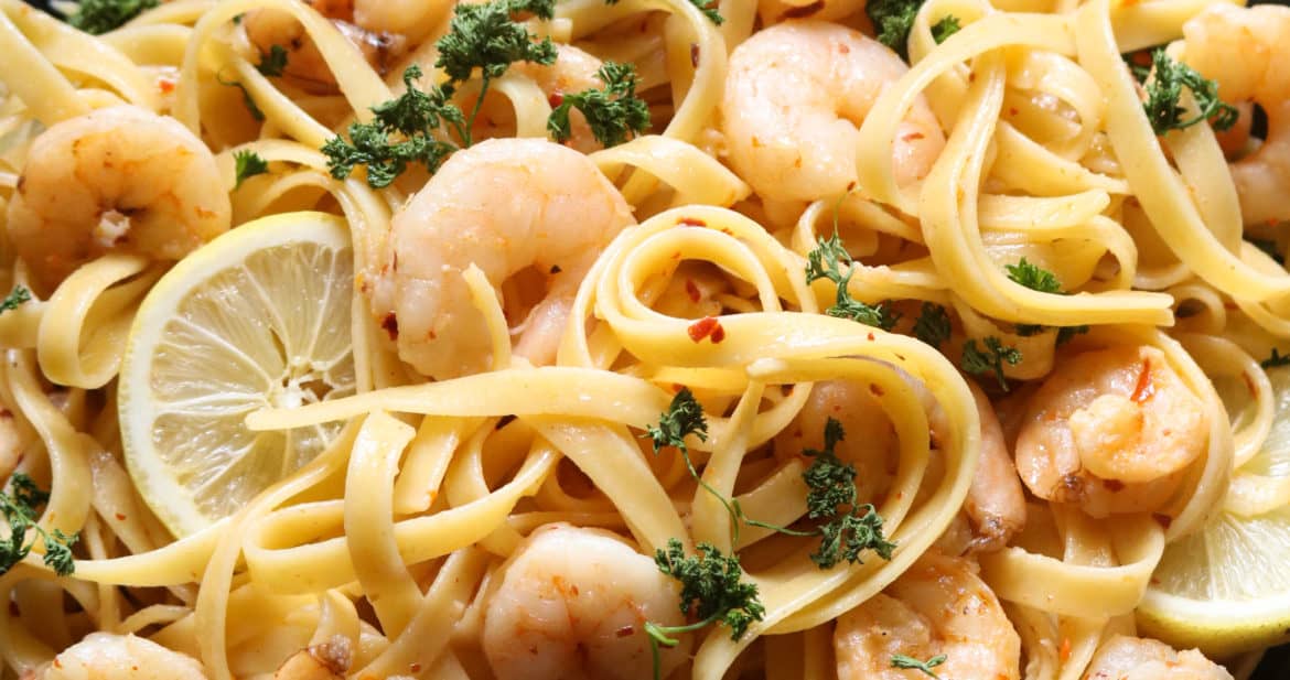 garlic lemon shrimp pasta served on a plate.