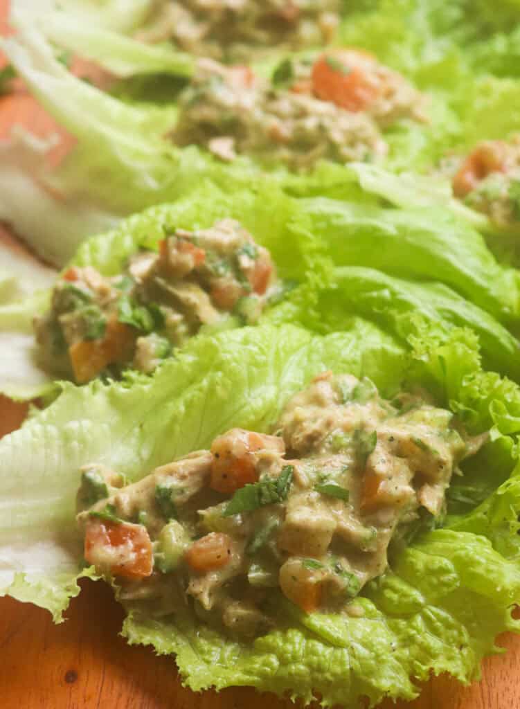 canned tuna lettuce wraps served on a wood platter.