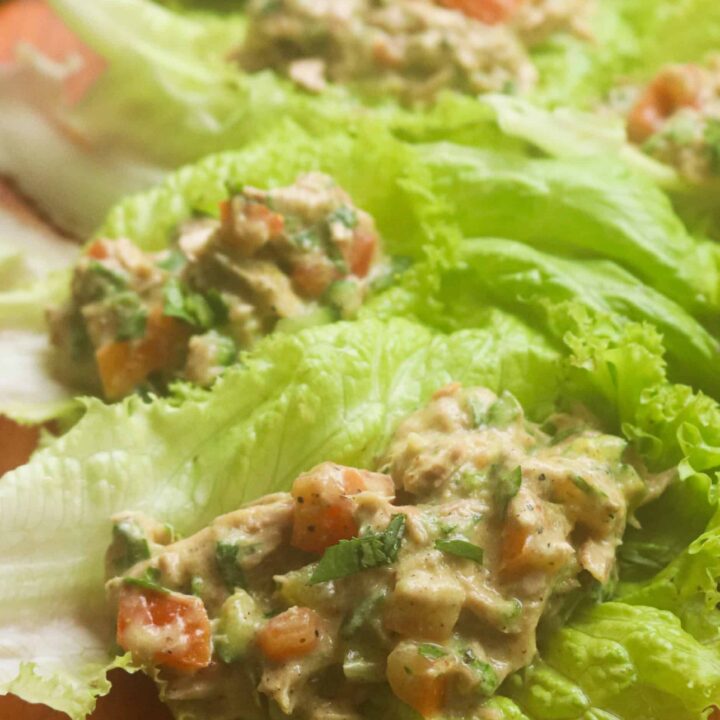 canned tuna lettuce wraps served on a wood platter.