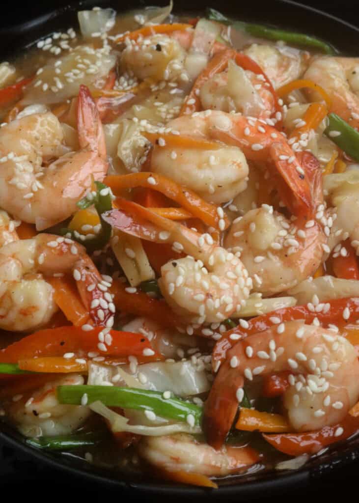 shrimp stir fry with bell peppers, cabbge and carrots.