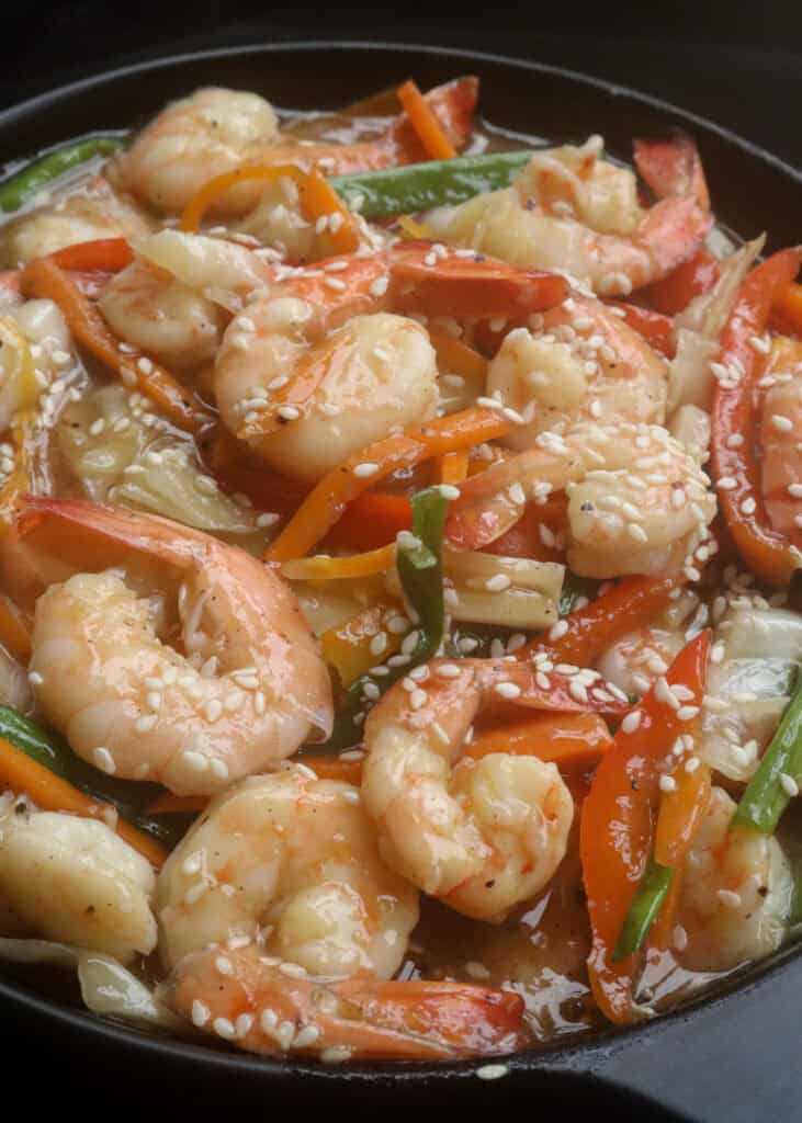 stir fried shrimp and veggies in a platter.