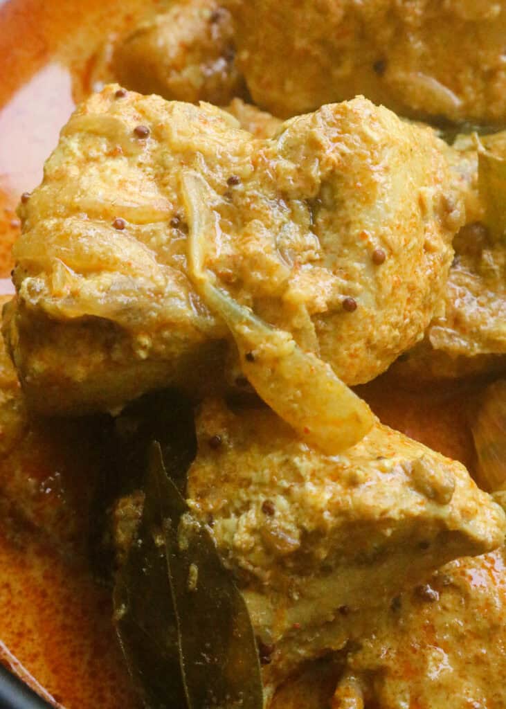 kerala fish curry wit cubes of fish cooked in coconut milk.