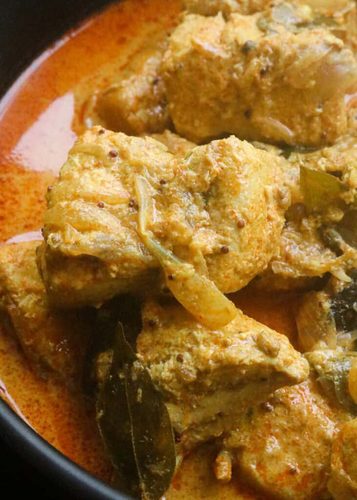 kerala fish curry with a thick coconut milk gravy that is cooked in spices.