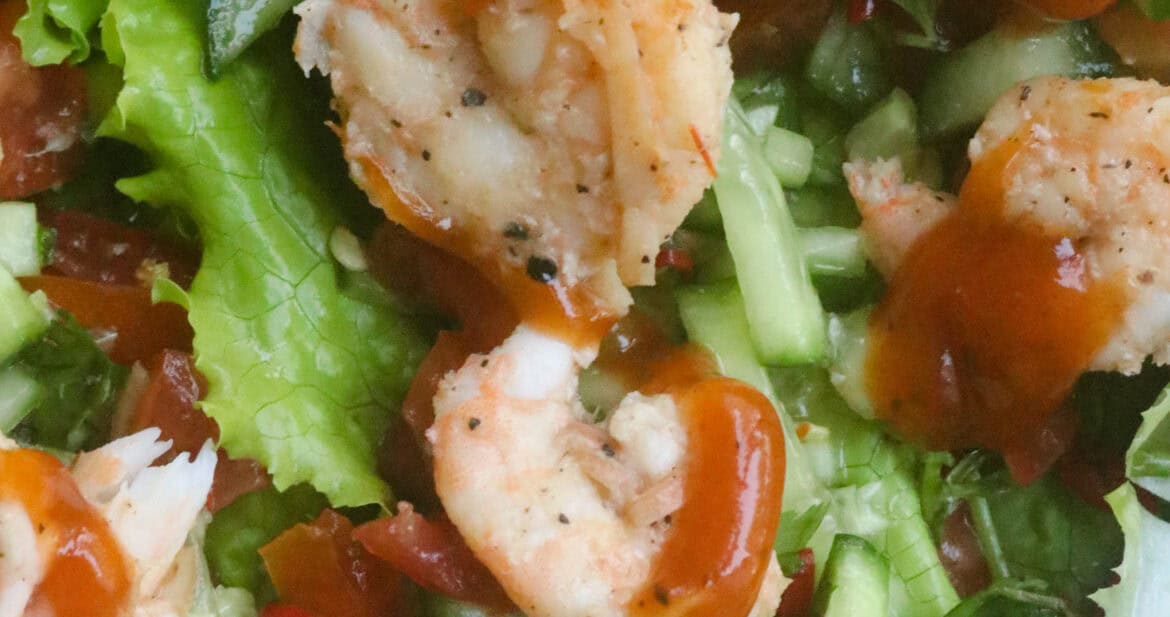 two or three lettuce full of tomatoes, cucumbers and shrimp.