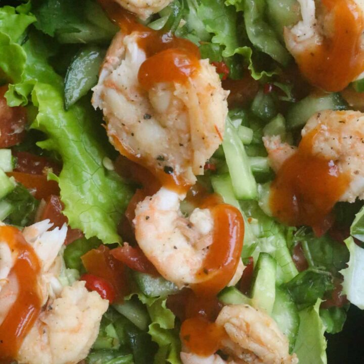 two or three lettuce full of tomatoes, cucumbers and shrimp.